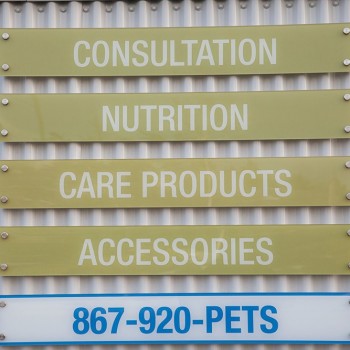 A photo of our signage indicating Consultation, Nutrition, Care Products and Accessories are available